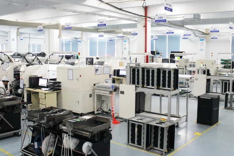 EV charger production floor with SMT lines, module assembly stations and test benches at the Amprisen factory in Suzhou
