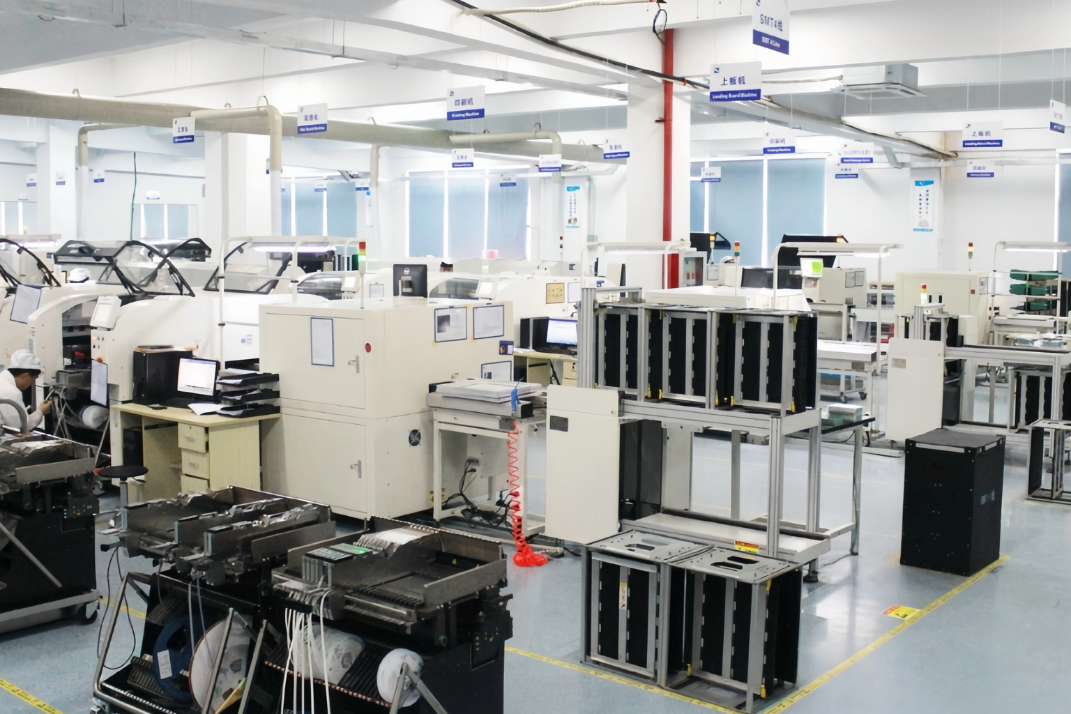 EV charger production floor with SMT lines, module assembly stations and test benches at the Amprisen factory in Suzhou